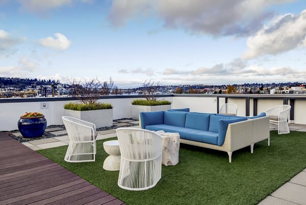 Chic outdoor patio with modern seating at Equinox Apartments