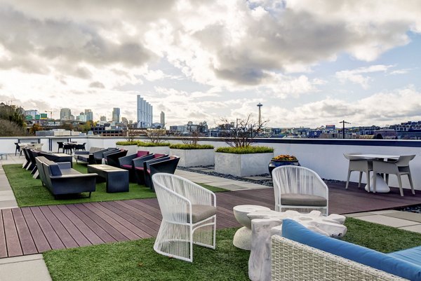 Luxurious rooftop patio offering skyline views at Equinox Apartments, perfect for relaxation and social gatherings in urban living