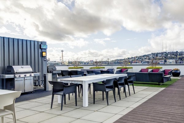 Rooftop patio with modern seating at Equinox Apartments luxury residence