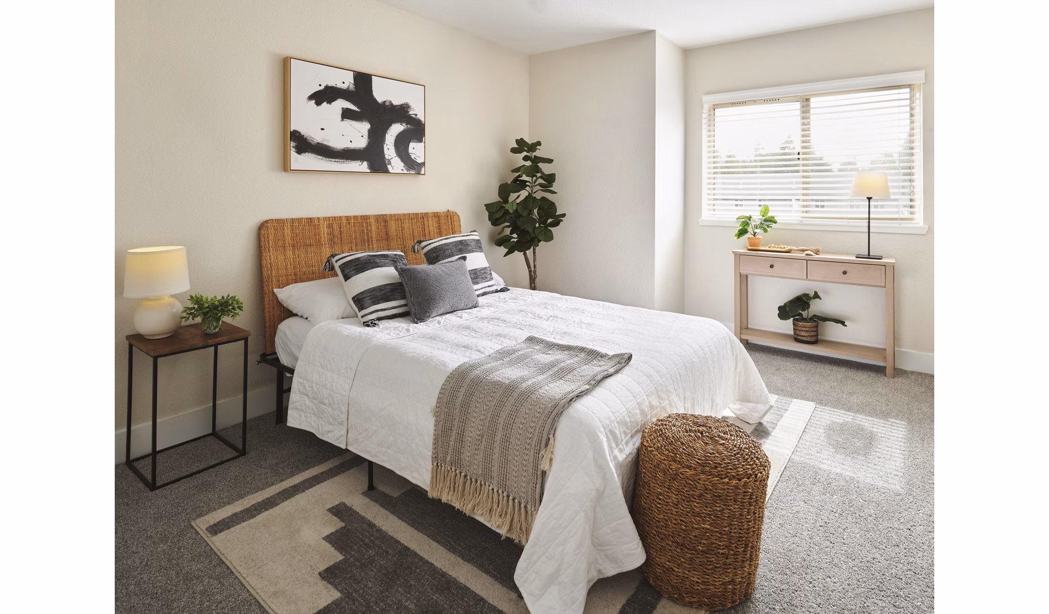 Spacious bedroom with modern decor at The Woodlands Apartments