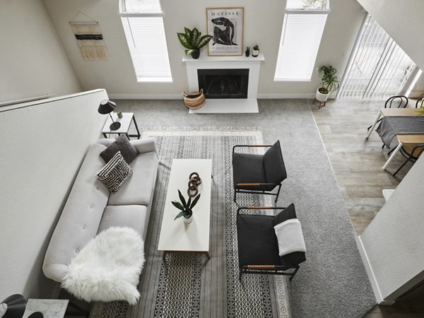 Spacious living room with modern decor in The Woodlands Apartments