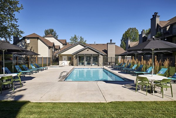 Sunny outdoor pool area at The Woodlands Apartments