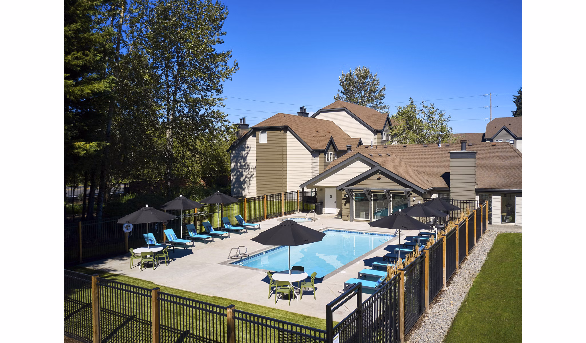 Infinity-edge pool at The Woodlands Apartments, offering a luxurious swimming experience in a serene natural setting