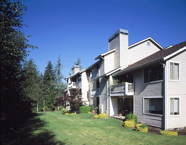Island Homestead Apartments: Charming garden-style community nestled in a lush green setting