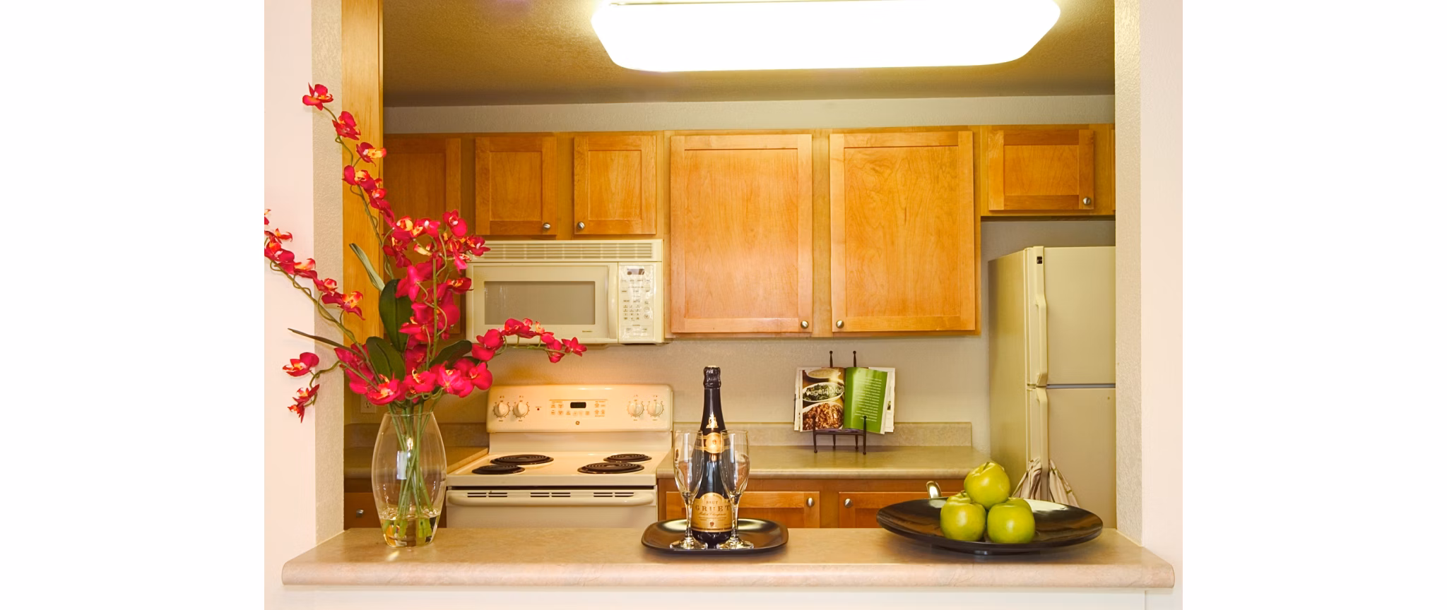 Modern kitchen with stainless steel appliances at Island Homestead Apartments