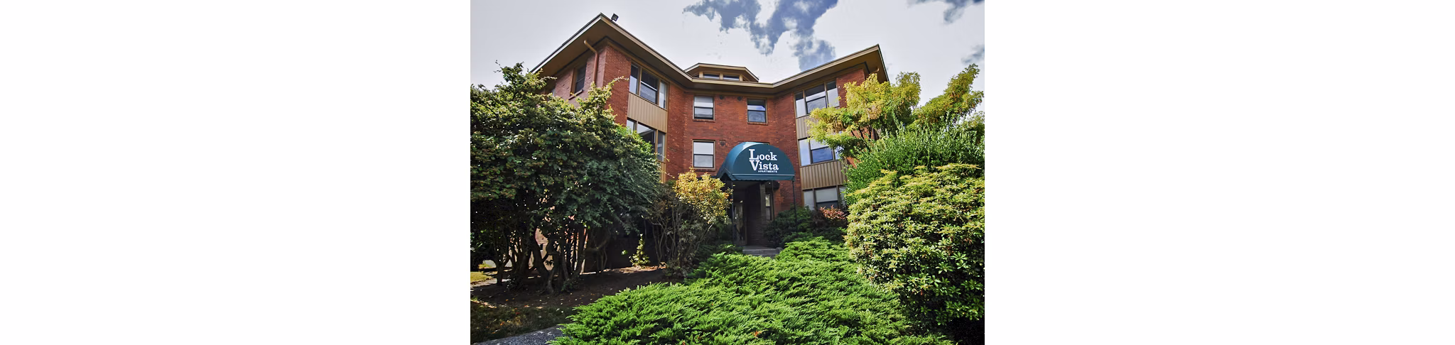 Lock Vista Apartments: Scenic view of modern luxury apartments in a serene setting