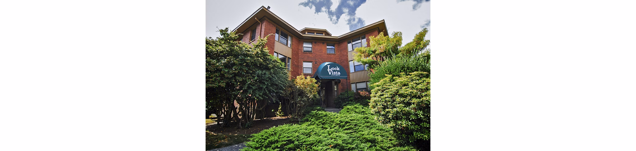 Lock Vista Apartments: Scenic view of modern luxury apartments in a serene setting