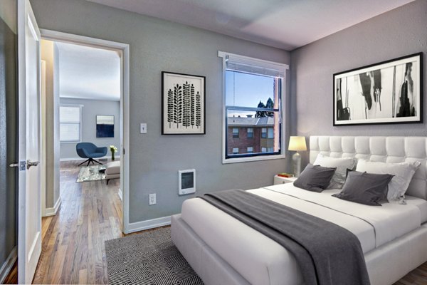 Cozy bedroom with modern furnishings at Lock Vista Apartments, luxury property offering premium living spaces