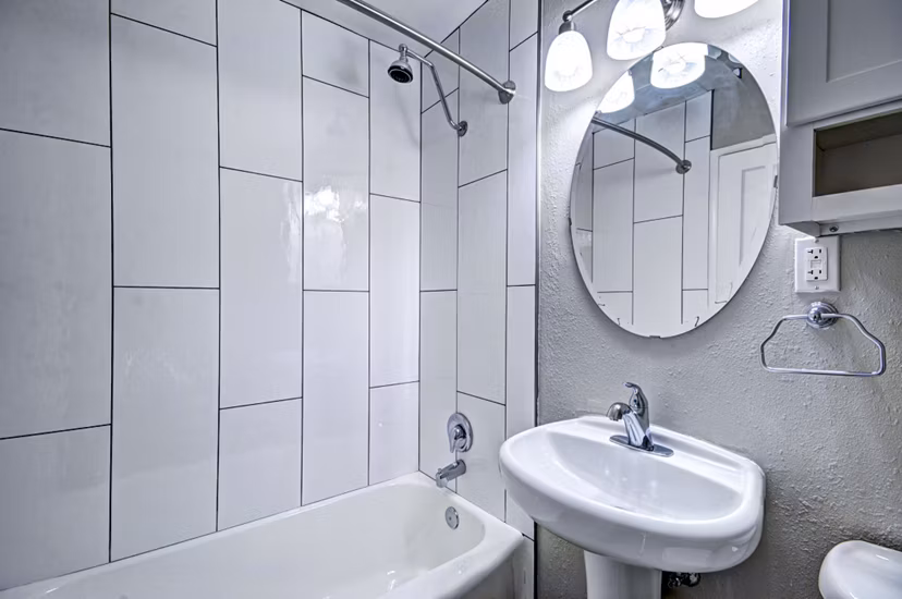 Luxurious bathroom featuring marble countertops and modern fixtures at Lock Vista Apartments, a Greystar luxury community
