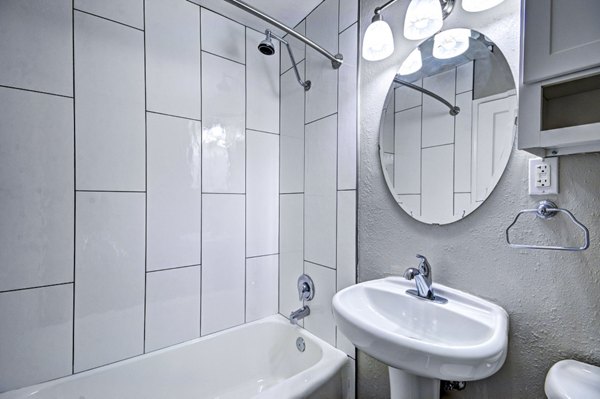 Luxurious bathroom featuring marble countertops and modern fixtures at Lock Vista Apartments, a Greystar luxury community