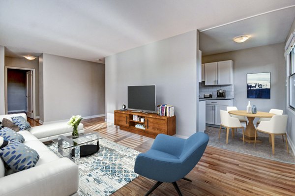 Cozy living room with modern dÃ©cor and natural light at Lock Vista Apartments