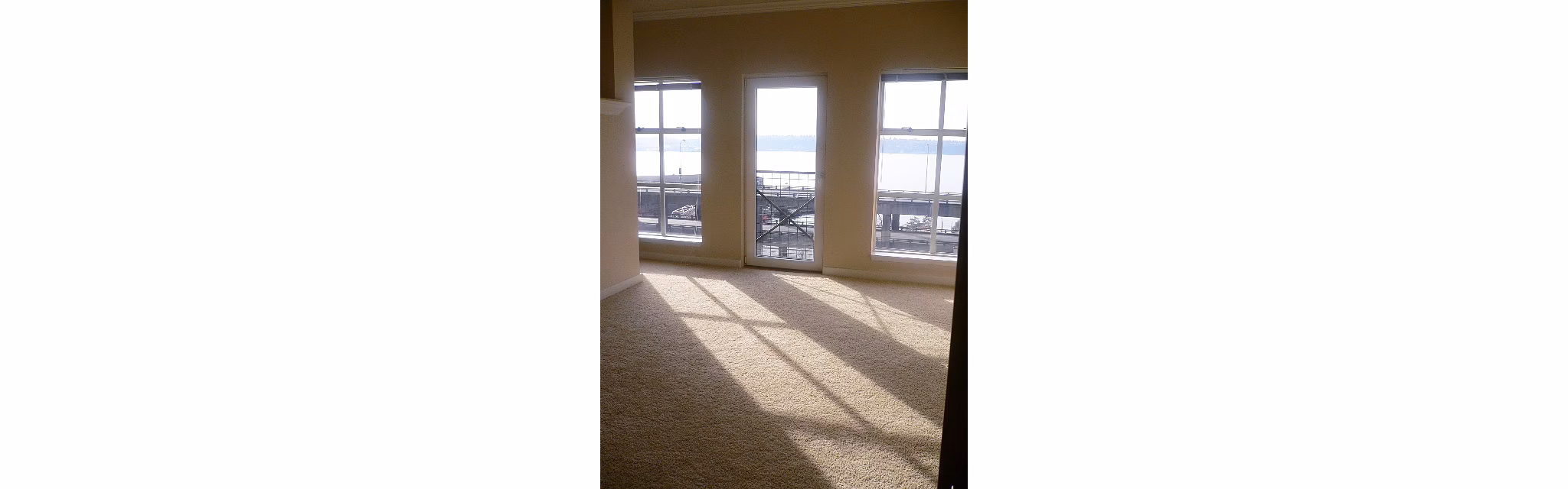 Living room with contemporary design and stylish decor at Post Alley Court Apartments, a Greystar luxury residence