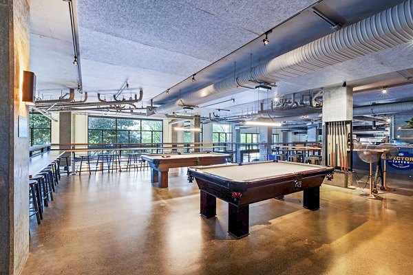 Game room with billiards and lounge at Via 6 Apartments, featuring luxury living in the heart of the city