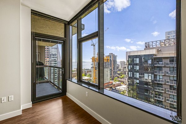 Modern living room with sleek furnishings and natural light at Via 6 Apartments, luxury apartments in Seattle