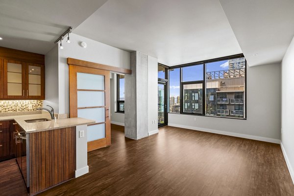 Comfortable living room with modern furnishings at Via 6 Apartments