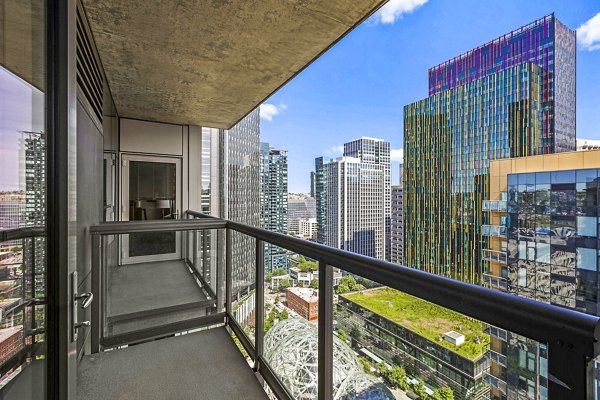 Patio balcony with cityscape views at Via 6 Apartments in Seattle