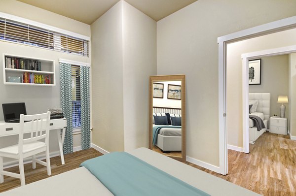 Cozy bedroom with modern design and ample natural light at Chelsea Heights Apartments