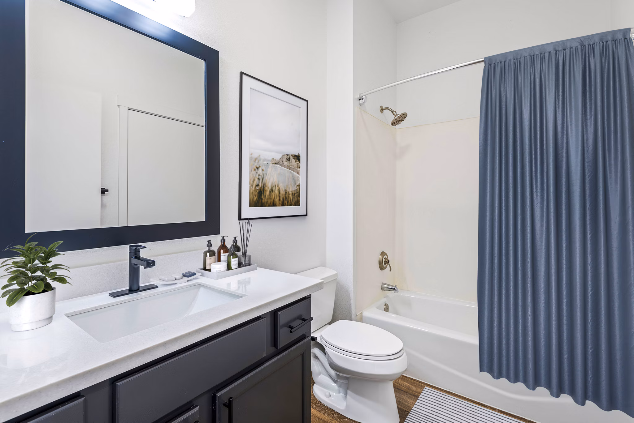 Modern bathroom featuring sleek fixtures and marble countertops at Chelsea Heights Apartments