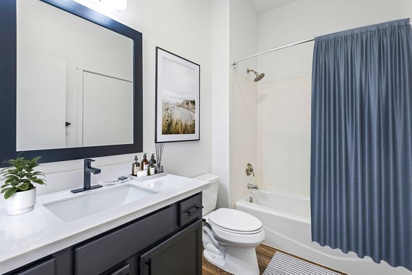 Modern bathroom featuring sleek fixtures and marble countertops at Chelsea Heights Apartments