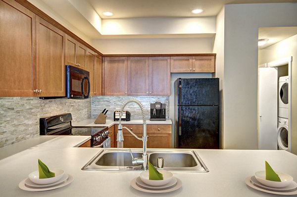 Modern kitchen featuring stainless steel appliances at Chelsea Heights Apartments