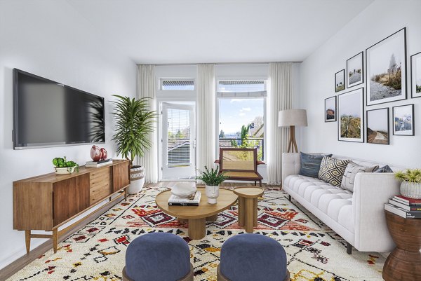 Living room with modern decor and large windows at Chelsea Heights Apartments