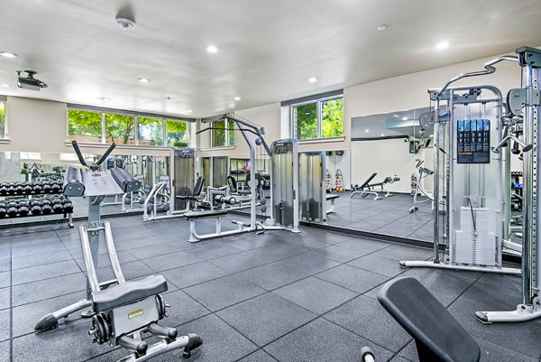 Modern fitness center with state-of-the-art equipment at Allez Apartments, perfect for luxury lifestyle and active living