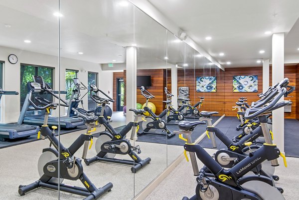 Modern fitness center featuring state-of-the-art equipment at Allez Apartments, ideal for active lifestyles and wellness enthusiasts