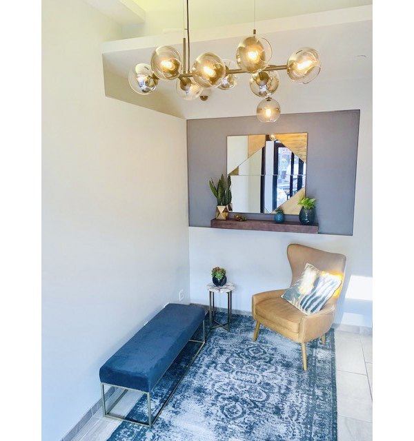 Contemporary hallway with sleek lighting at The Atlantic Stamp Building Apartments, a luxury property managed by Greystar