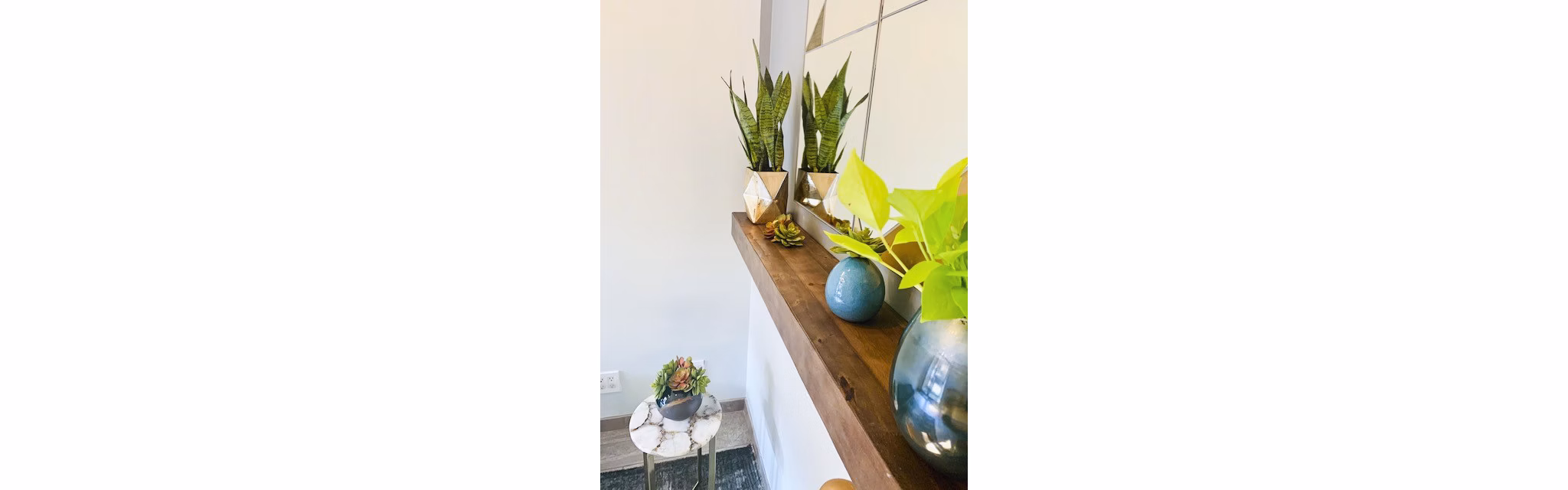 Hallway adorned with modern art and lighting at The Atlantic Stamp Building Apartments, a luxury Greystar community in Brooklyn