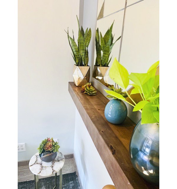 Hallway adorned with modern art and lighting at The Atlantic Stamp Building Apartments, a luxury Greystar community in Brooklyn