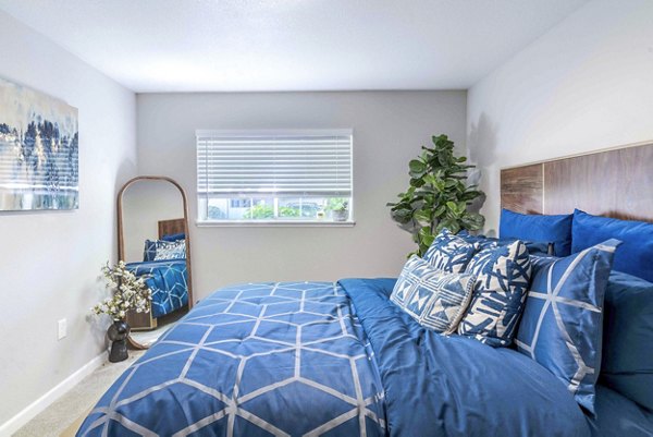 Cozy bedroom with modern decor at Avana One Zero Nine Apartments