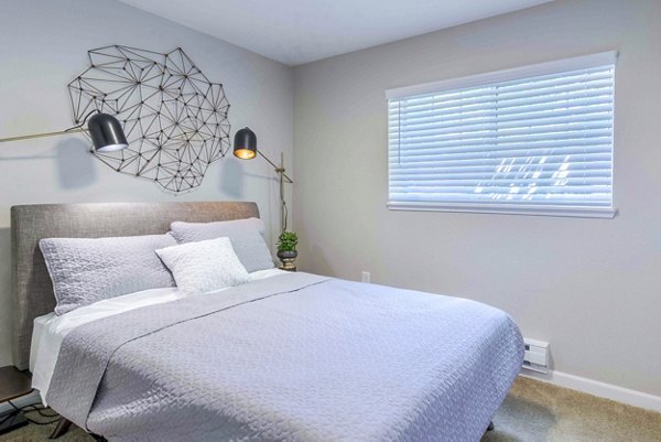 Bedroom featuring stylish decor and modern furnishings at Avana One Zero Nine Apartments
