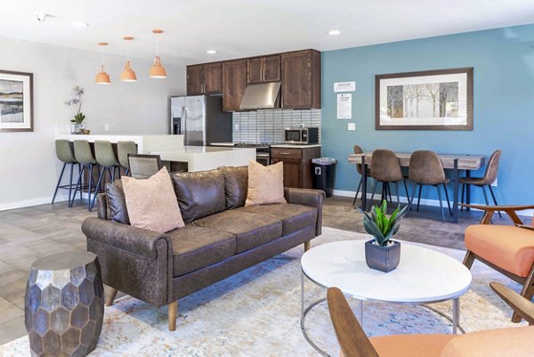 Clubhouse with modern decor and ample seating at Avana One Zero Nine Apartments in Charleston