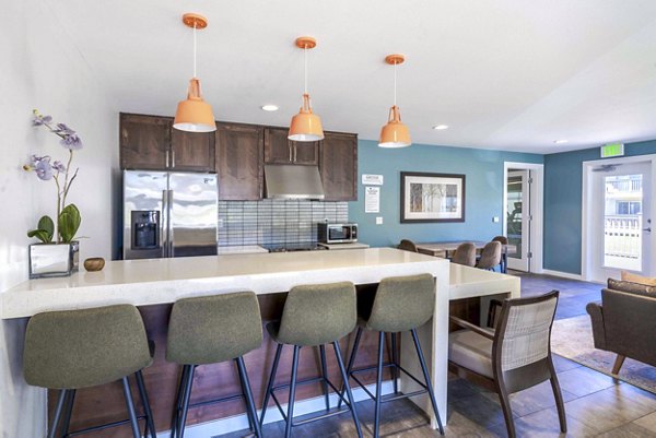 Clubhouse with modern furnishings and entertainment areas at Avana One Zero Nine Apartments