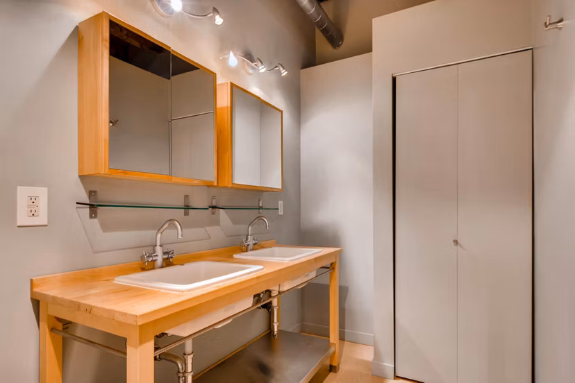 Modern bathroom featuring sleek design and spacious layout at Albers Mill Lofts Apartments