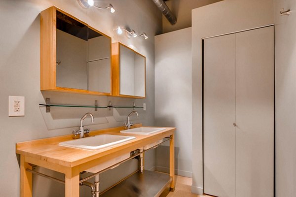 Modern bathroom featuring sleek design and spacious layout at Albers Mill Lofts Apartments
