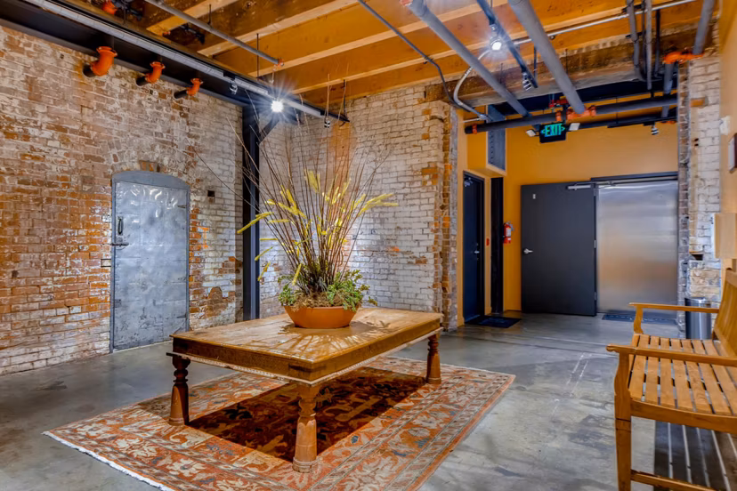 Clubhouse featuring modern decor and seating at Albers Mill Lofts Apartments