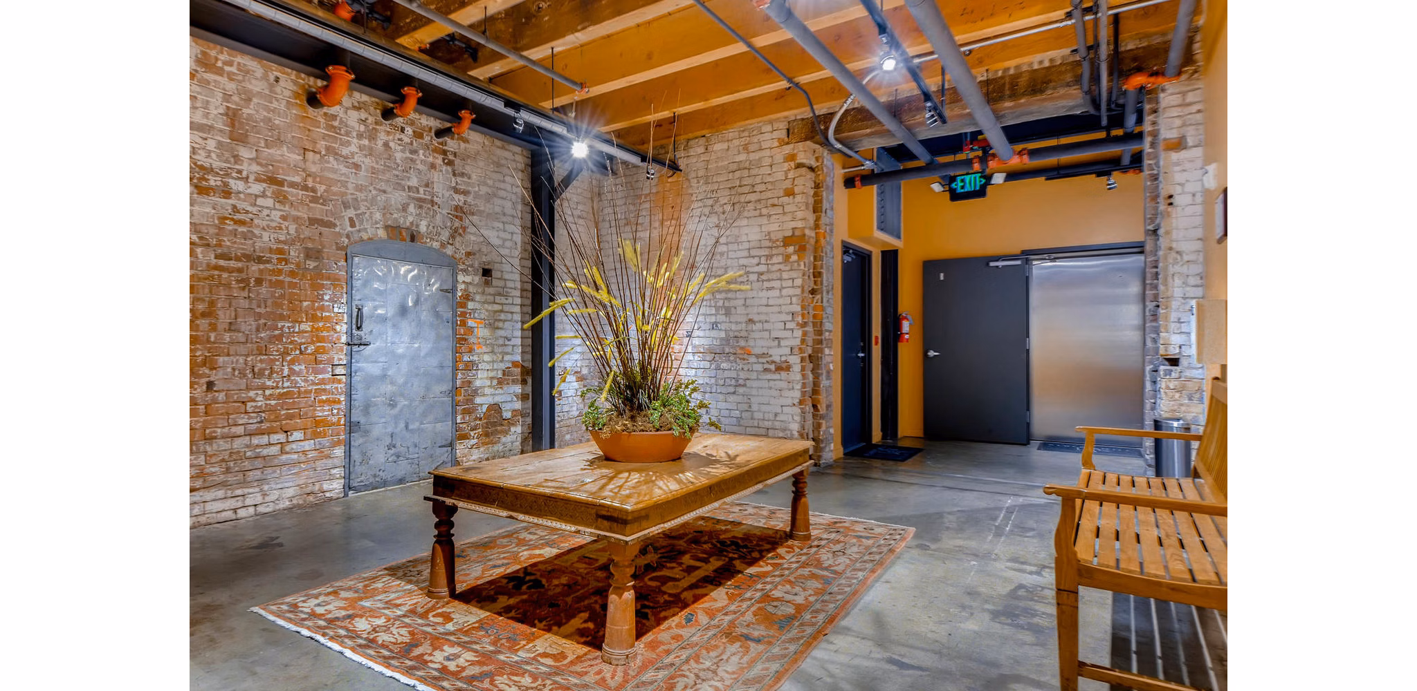 Clubhouse featuring modern decor and seating at Albers Mill Lofts Apartments