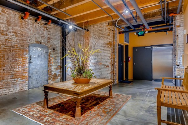 Clubhouse featuring modern decor and seating at Albers Mill Lofts Apartments