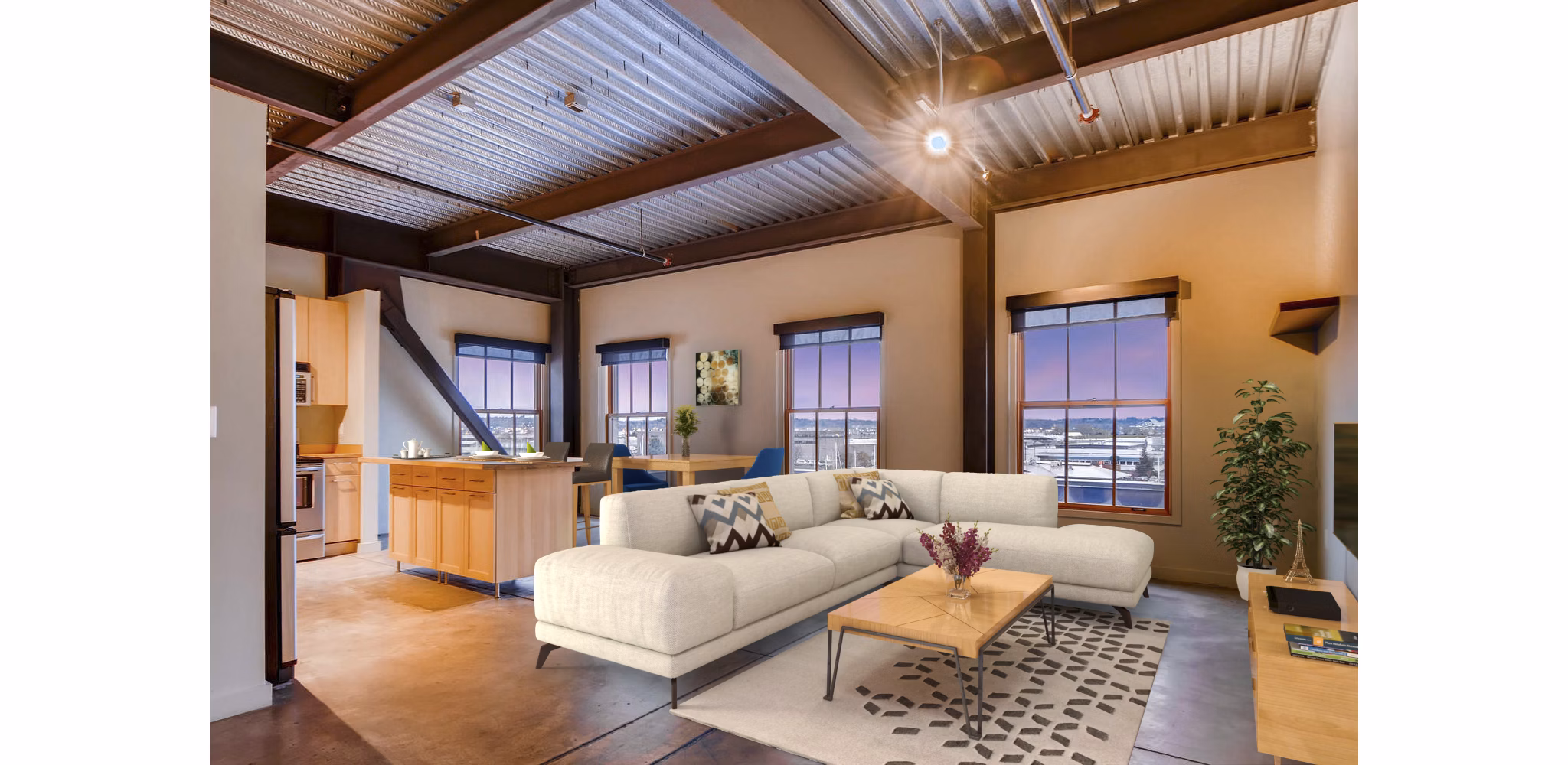 Spacious living room with exposed brick and modern decor in Albers Mill Lofts Apartments in luxury Greystar property