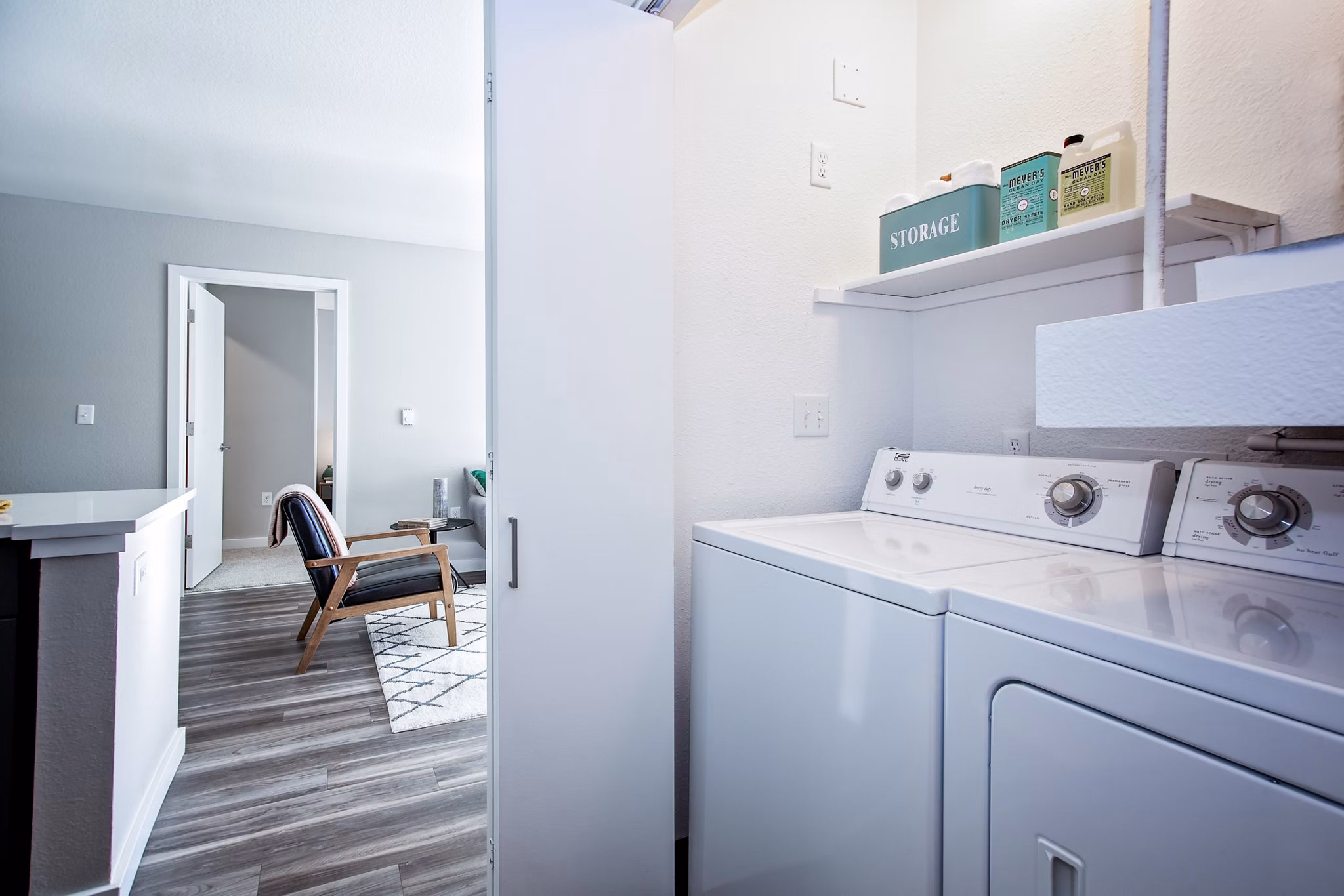 Laundry room with modern appliances at Seven West at the Trails Apartments