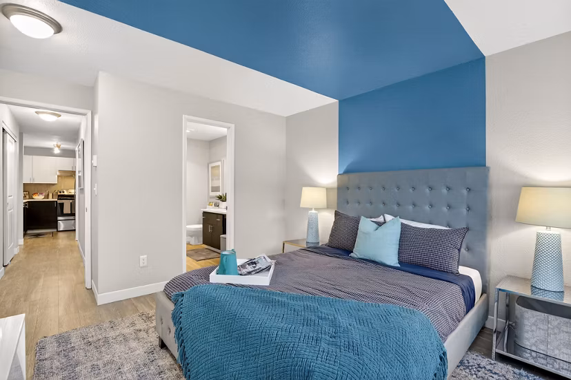Cozy bedroom with modern decor at Rivercrest Meadows Apartments