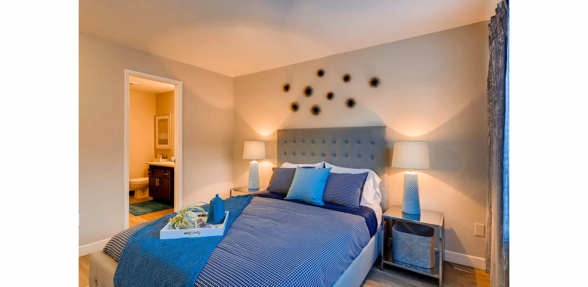 Cozy bedroom with modern decor at Rivercrest Meadows Apartments