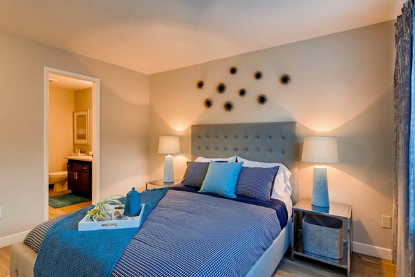 Cozy bedroom with modern decor at Rivercrest Meadows Apartments