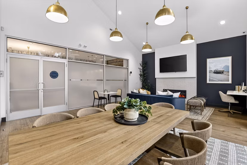 Clubhouse with modern design and comfy seating at Rivercrest Meadows Apartments