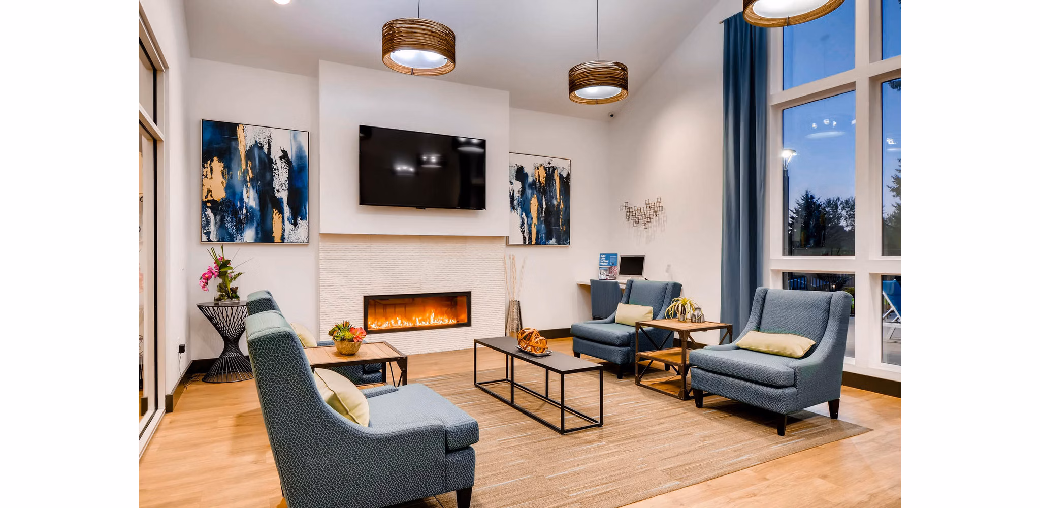 Clubhouse with modern design and comfy seating at Rivercrest Meadows Apartments
