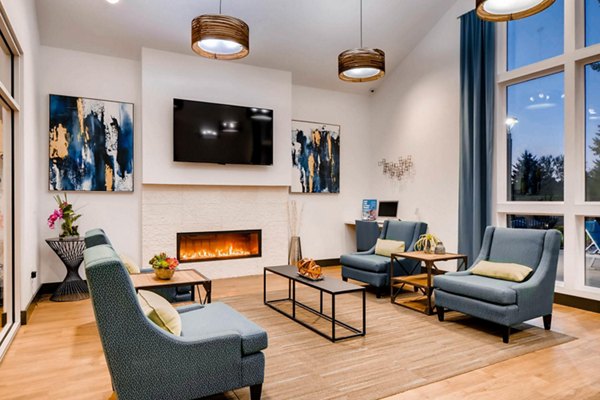 Clubhouse with modern design and comfy seating at Rivercrest Meadows Apartments