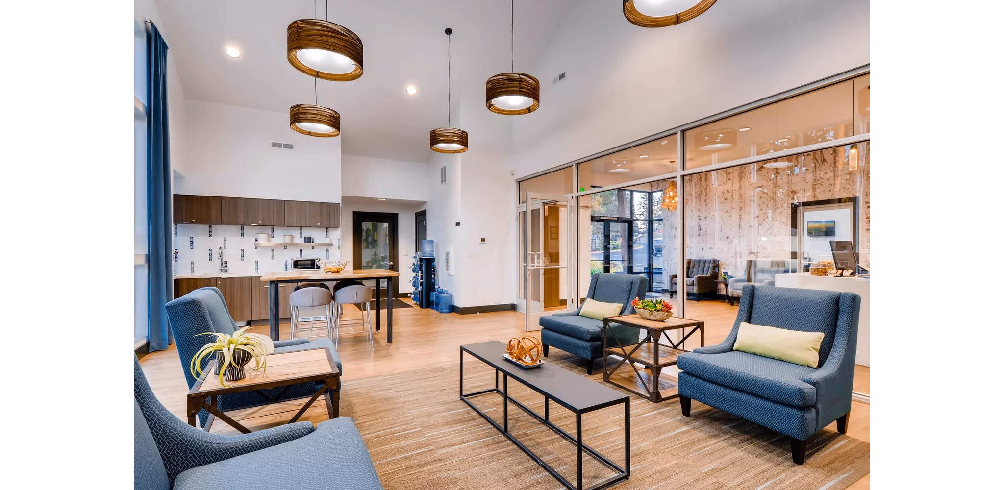 Clubhouse with modern decor and seating at Rivercrest Meadows Apartments