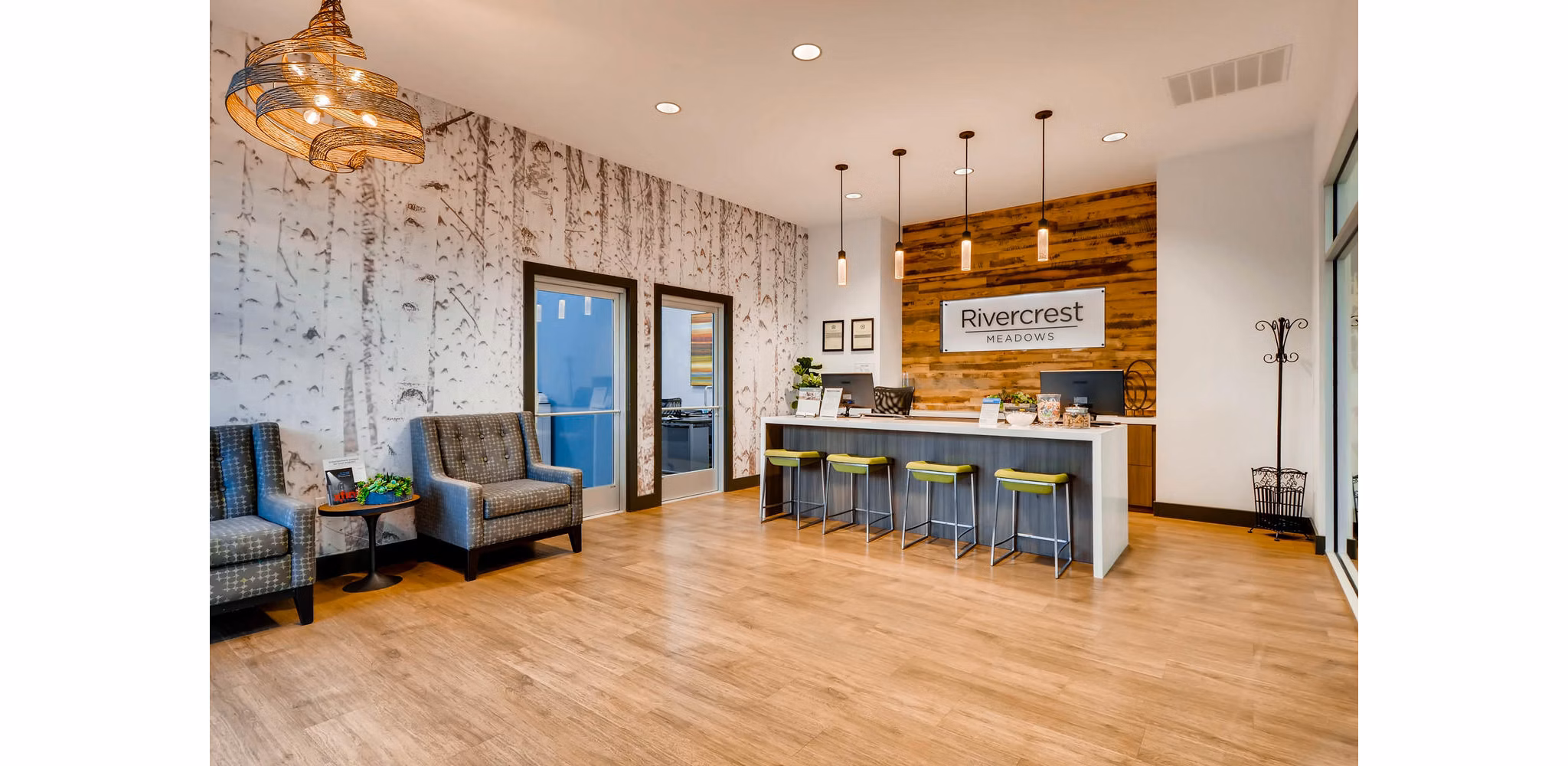 Clubhouse in Rivercrest Meadows Apartments featuring modern design and ample seating Perfect for social gatherings and community events