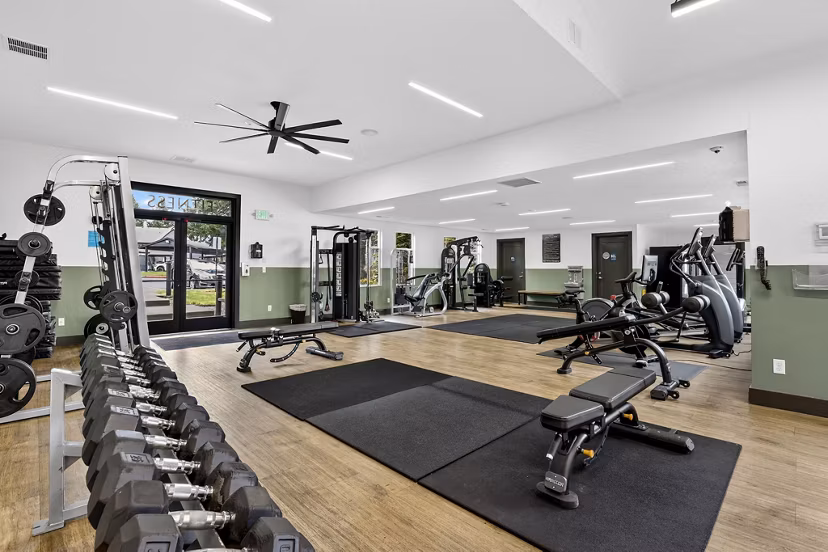Modern fitness center with state-of-the-art equipment at Rivercrest Meadows Apartments